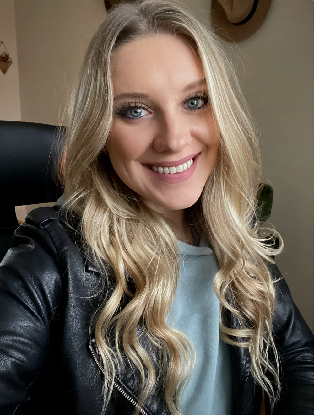 Melissa, Regional Sales Lead at VM Promotional, smiling in a black leather jacket